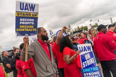 President Joe Biden walks along the UAW picket line and engages with union members at the GM Willow Run Distribution Center, Tuesday, September 26, 2023, in Belleville, Michigan.
