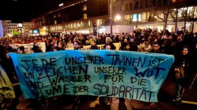 Anti-Nazi rally in Berlin-Neukölln. The banner says, “Each of our tears is a sign of our rage and water for the flower of solidarity.”