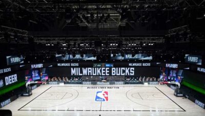 The court and benches are empty of players and coaches at the scheduled start of an NBA basketball first round playoff game between the Milwaukee Bucks and the Orlando Magic, Wednesday, Aug. 26, 2020, in Lake Buena Vista, Fla.