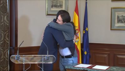 Pedro Sánchez and Pablo Iglesias hug at their November 12, 2019 announcement of their agreement to form a coalition government. The formation of the coalition government prompted Anticapitalistas to leave Podemos.