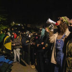 Protesters gathered in front of the barricade between Siemens and Nelson Halls. Humboldt College, April 29. Photo by Alex Anderson.